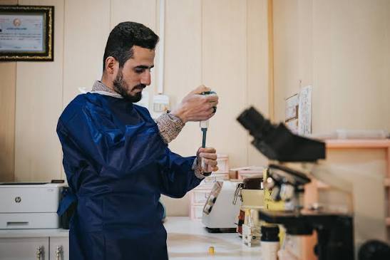 Laboratory specialist handling diagnostic samples